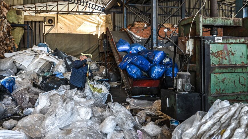 A worker sorts out plastic waste collected at a plastic recycling factory in Kartepe, district of Kocaelion, Turkey, May 11, 2022.
