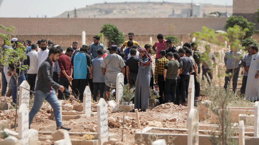 Mourners take part in a funeral of people killed in reported artillery fire by Syrian government forces, in the opposition-held city of al-Bab, on the border with Turkey in the northern Aleppo province, Syria, Aug. 19, 2022.