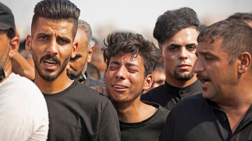 Iraqi mourners attend the funeral of two Saraya al-Salam fighters.