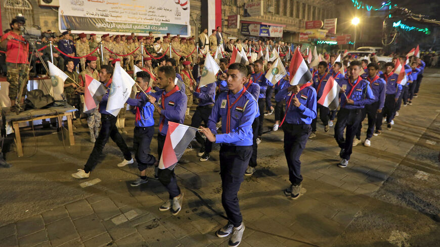 Yemeni scouts participate in an official parade marking the eighth anniversary of the Houthi takeover of Sanaa, Yemen, Sept. 20, 2022.