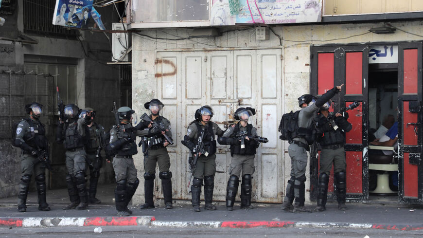 Israeli border guards are pictured during clashes with Palestinian demonstrators in the area of Bab al-Zawiya in the center of the city of Hebron, West Bank, Sept. 29, 2022.