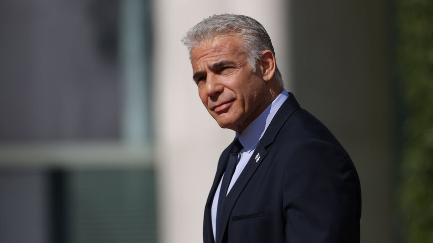 Interim Israeli Prime Minister Yair Lapid arrives to meet with German Chancellor Olaf Scholz at the Chancellery, Berlin, Germany, Sept. 12, 2022.