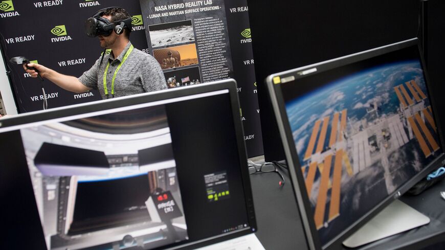 Rodolfo Campos uses a virtual reality headset during a NASA Hybrid Reality Lab demonstration at the NVIDIA GPU Technology Conference.