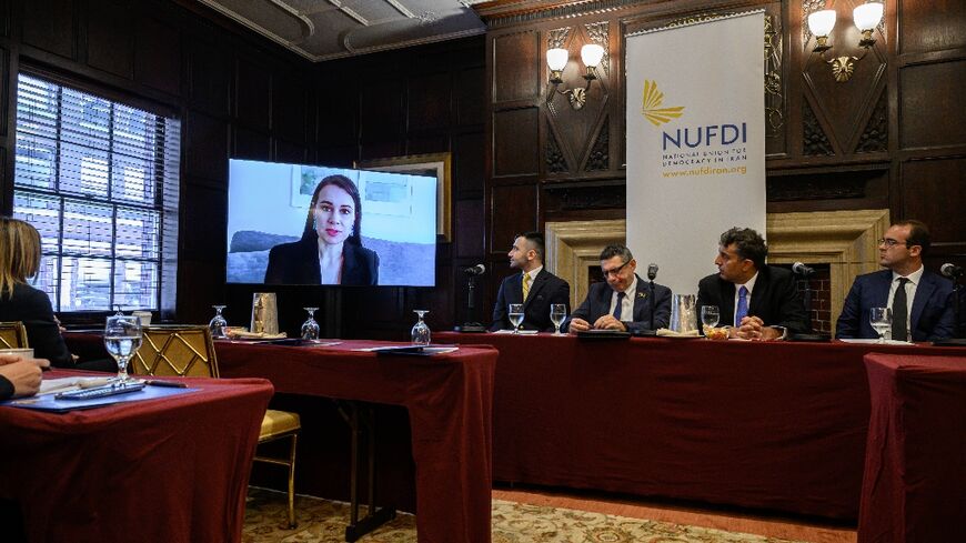British-Australian academic and former prisoner in Iran, Kylie Moore-Gilbert (L), speaks by video to a press conference by Iranian dissidents and ex-prisoners who filed a US lawsuit against Iranian President Ebrahim Raisi