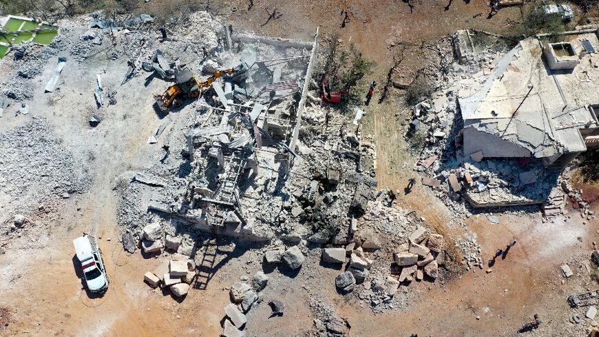 This aerial view shows the damage to buildings caused by a reported pro-regime forces bombing, in the Syrian rebel-held western countryside of Idlib, on September 8, 2022