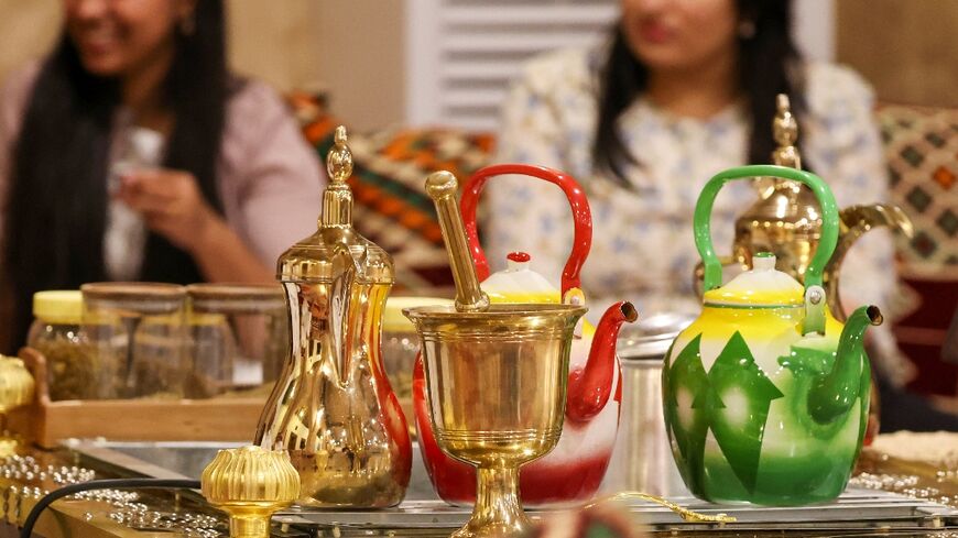 Golden 'dallah' pots are used for traditional 'gahwa', prepared by roasting coffee beans then boiling them with cardamom and saffron