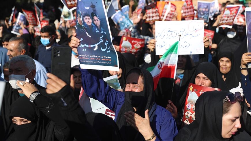 The shooting at a key Shiite shrine in Shiraz came on the same day that thousands paid tribute to Mahsa Amini across Iran