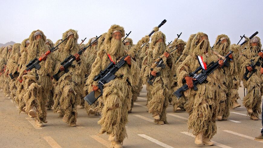 Fighters loyal to Yemen's Saudi-backed government take part in a military parade in the country's northeastern province of Marib, on September 26