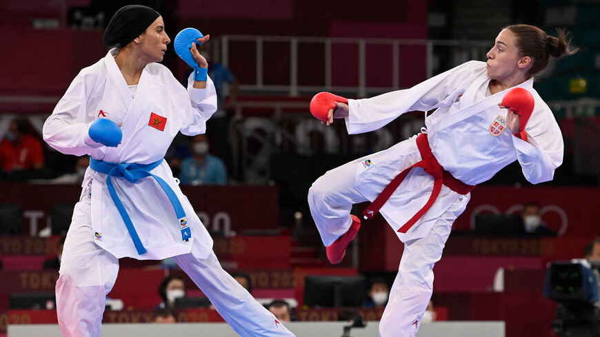Morocco's Btissam Sadini (L) competes against Serbia's Jovana Prekovic in the women's kumite -61kg elimination round of the karate competition during the Tokyo 2020 Olympic Games at the Nippon Budokan, Tokyo, Japan, Aug. 6, 2021.