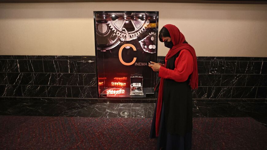 An Iranian arrives for the opening day of the Tehran International Short Film Festival (TISFF) in the Iranian capital on Oct. 19, 2021.