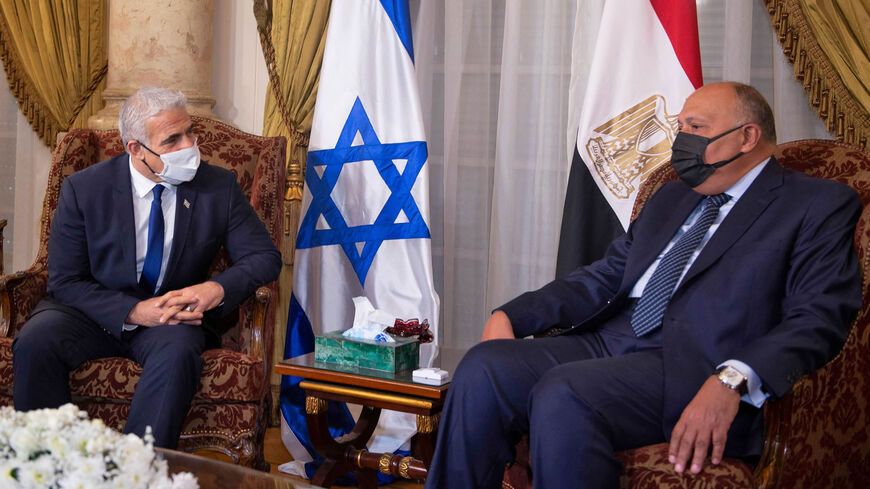 Israeli Foreign Minister and alternate Prime Minister Yair Lapid meets with Egypt's Foreign Minister Sameh Shoukry at Tahrir Palace, Cairo, Egypt, Dec. 9, 2021.