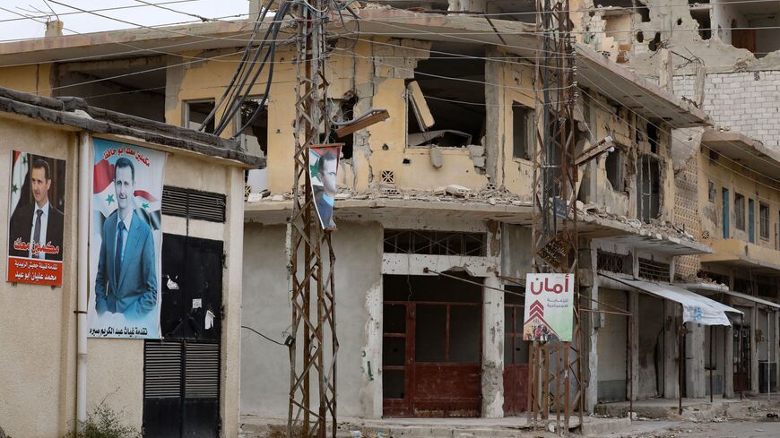 This picture shows the damage in a street in the central Syrian town of al-Qaryatain in Homs province.
