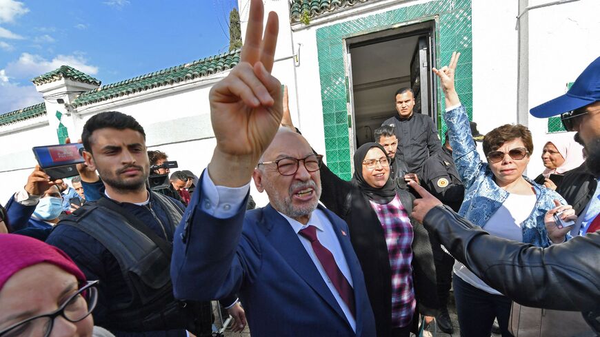 Tunisia's Speaker of the Parliament Rached Ghannouchi flashes the victory sign as he arrives for questioning at the judicial police headquarters in the capital Tunis, on April 1, 2022. 