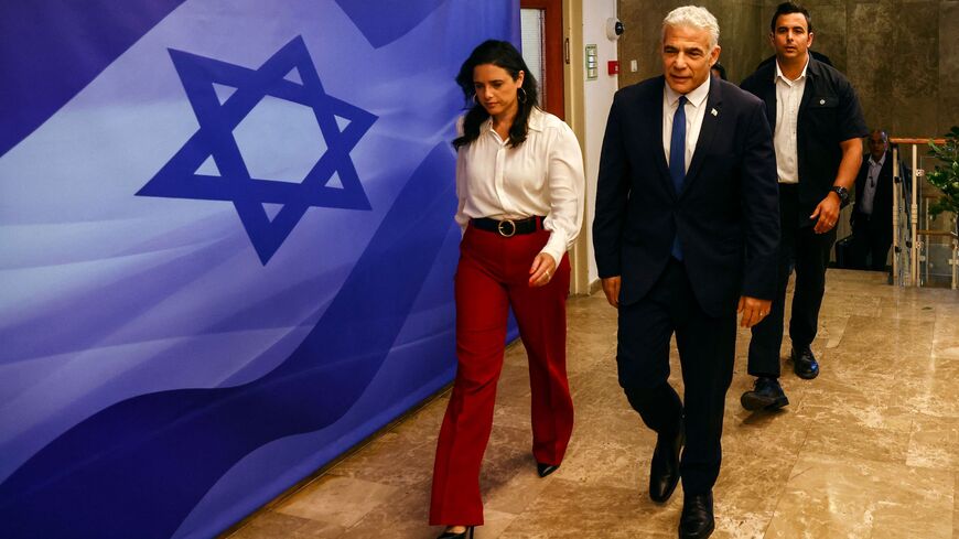 Israeli Prime Minister Yair Lapid and Interior Minister Ayelet Shaked (L).