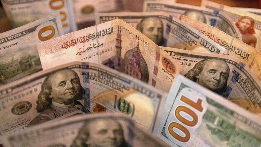The Egyptian pound and US dollar banknotes are seen in this photo taken on Aug. 25, 2022.