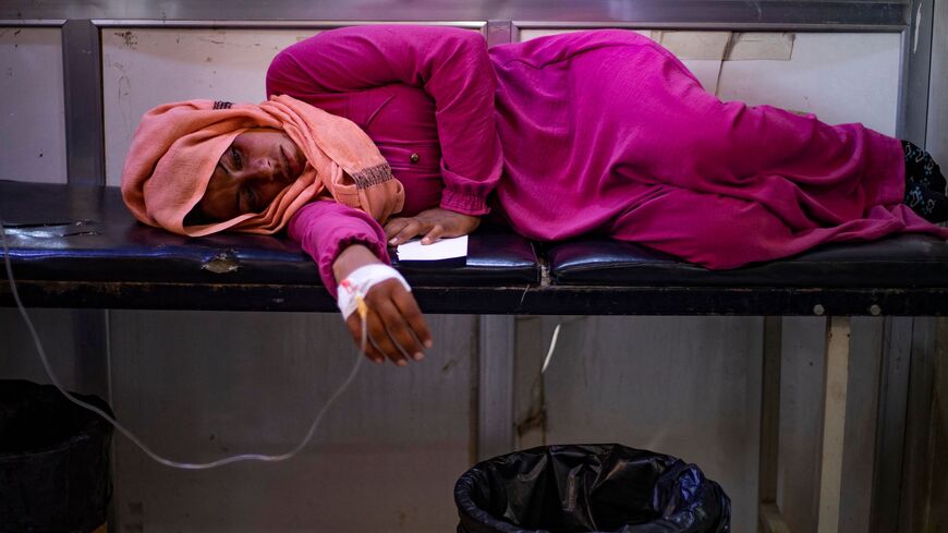 A woman suffering from cholera receives treatment at the Al-Kasrah hospital in Syria.