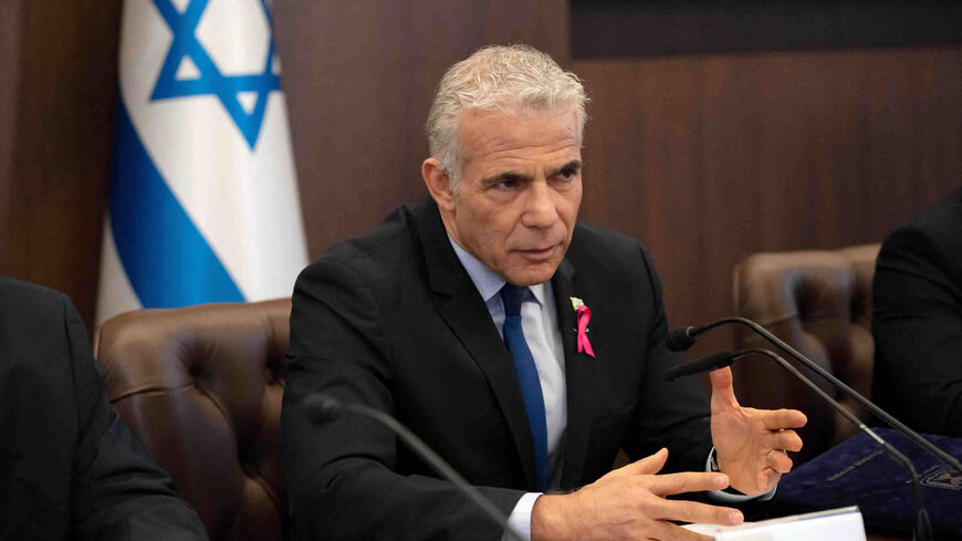 Israeli Prime Minister Yair Lapid makes an opening statement as he chairs the weekly Cabinet meeting,  Jerusalem, Oct. 2, 2022.