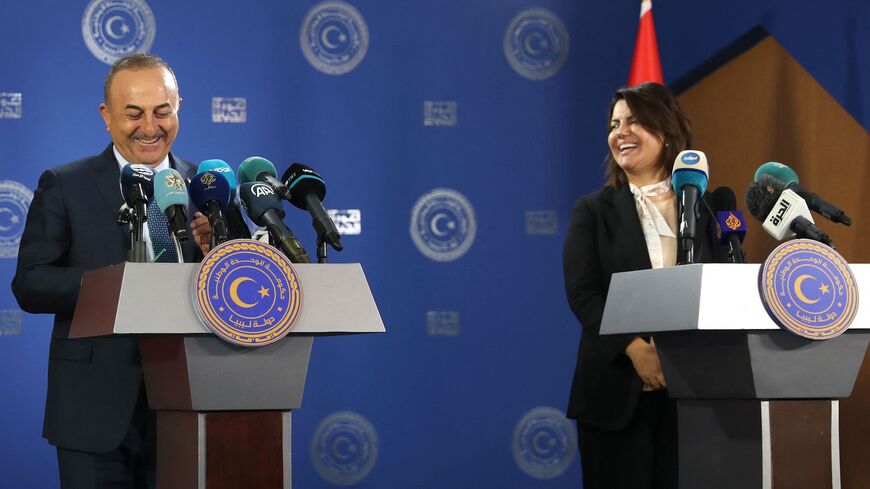 Libyan Foreign Minister Najla al-Mangoush (R) and Turkish Foreign Minister Mevlut Cavusoglu.