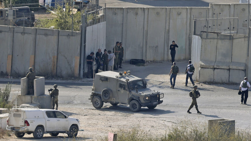 Israeli security forces deploy in the Deir Sharaf area, near the Israeli settlement of Shavei Shomron, west of Nablus, following a reported attack, West Bank, Oct. 11, 2022.