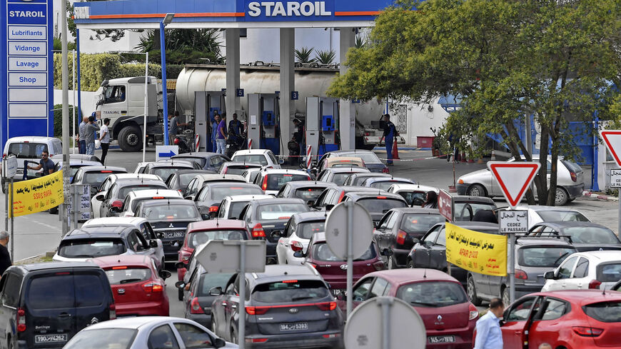 Tunisians line up with their vehicles outside a gas station, Tunis, Tunisia, Oct. 13, 2022.