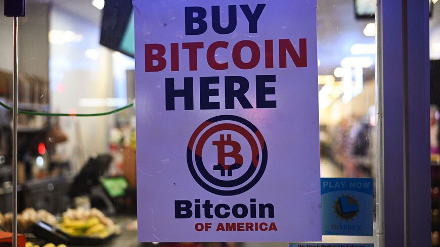 A sign offering Bitcoin for sale is seen in a store window in Hollywood, California, Oct. 20, 2022