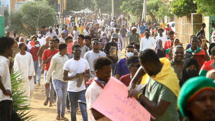 Sudanese protesters chant slogans as they march in Omdourman, Sudan, Oct. 21, 2022. 