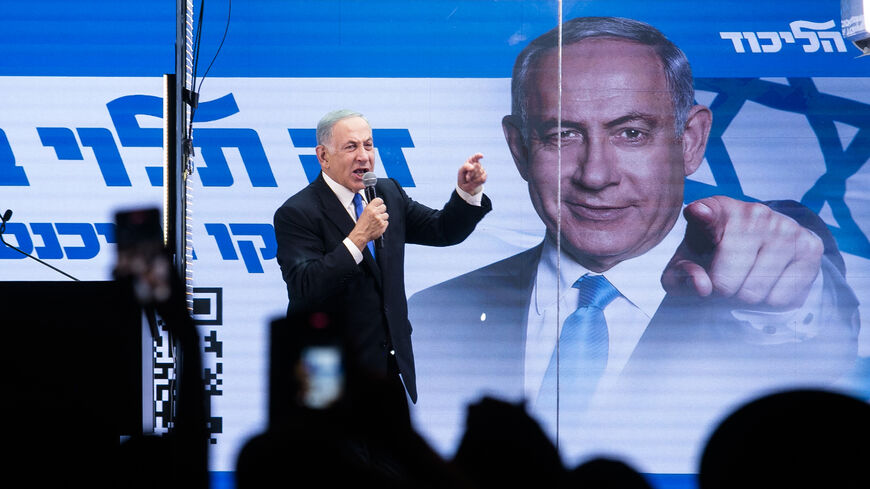 Former Israeli Prime Minister and Likud party leader Benjamin Netanyahu speaks to supporters inside a modified truck with a side bulletproof glass during a campaign event, Bnei Brak, Israel, Oct. 29, 2022.