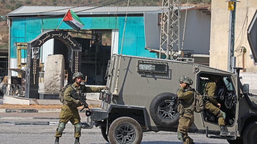 Israeli security forces deploy in the Deir Sharaf area, near the Israeli settlement of Shavei Shomron, west of Nablus in the occupied West Bank, on October 11