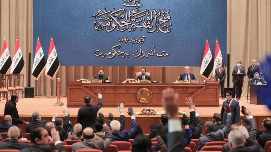 Iraqi Parliament Speaker Mohammed al-Halbussi, seated at the centre in this file picture, said lawmakers plan to elect a new president on Thursday