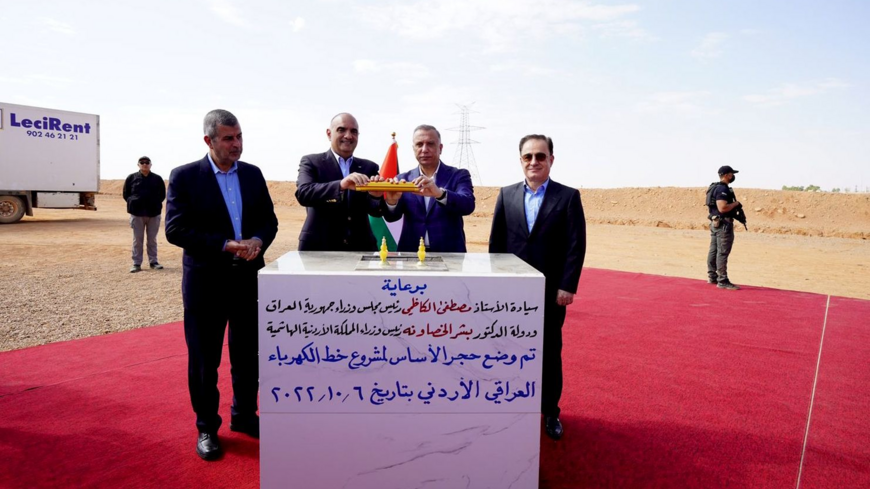 Iraqi Prime Minister Mustafa al-Kadhimi (2nd right) and his Jordanian counterpart, Bisher al-Khasawneh (2nd left), are seen during the launching ceremony of the electrical grid connection project between the two countries, Anbar province, Iraq, Oct. 6, 2022.