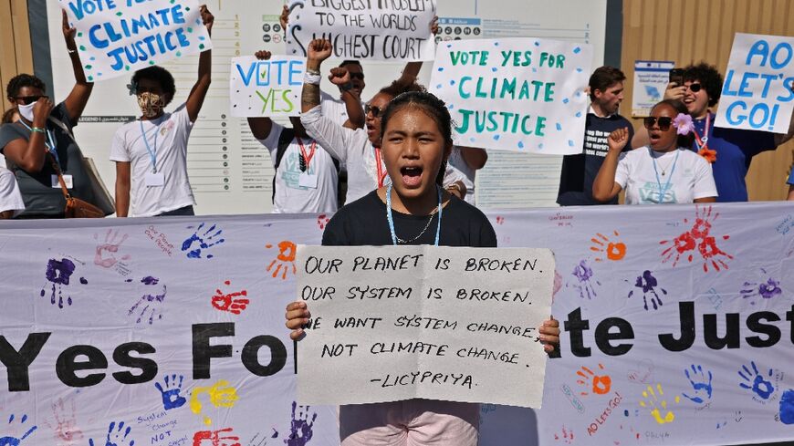 Members of the activist group Pacific Island Students Fighting Climate Change (PISFCC) stage a protest during the COP27 climate conference in the Egyptian restort town of Sharm el-Sheikh