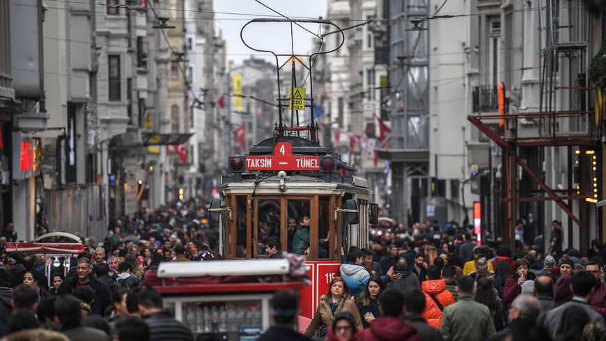 A tramway drives through a crowd in Istiklal avenue on Jan. 25, 2019 in central Istanbul.