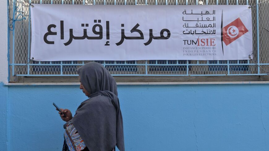 A Tunisian voter waits outside a polling station in Tunis on Oct. 13, 2019.
