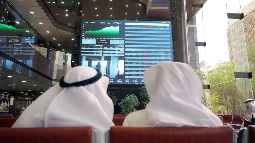 Traders follow the movement of stock prices at the Boursa Kuwait (Kuwait Stock Exchange) in Kuwait City on March 2, 2022.