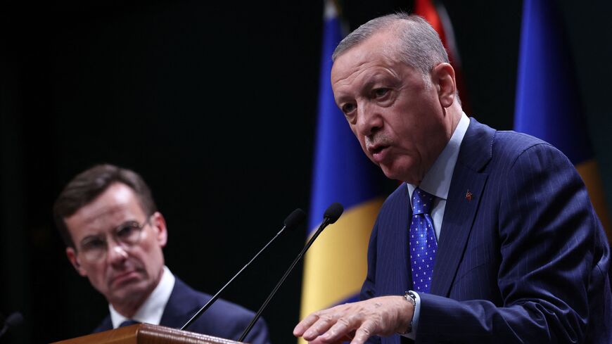 Turkish President Recep Tayyip Erdogan (R) and Swedish Prime Minister Ulf Kristersson (L) hold a press conference following their meeting at the Presidential Palace in Ankara on November 8, 2022.