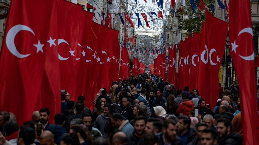 Pedestrians walk through Istiklal Ave. in Istanbul on Nov. 14, 2022.