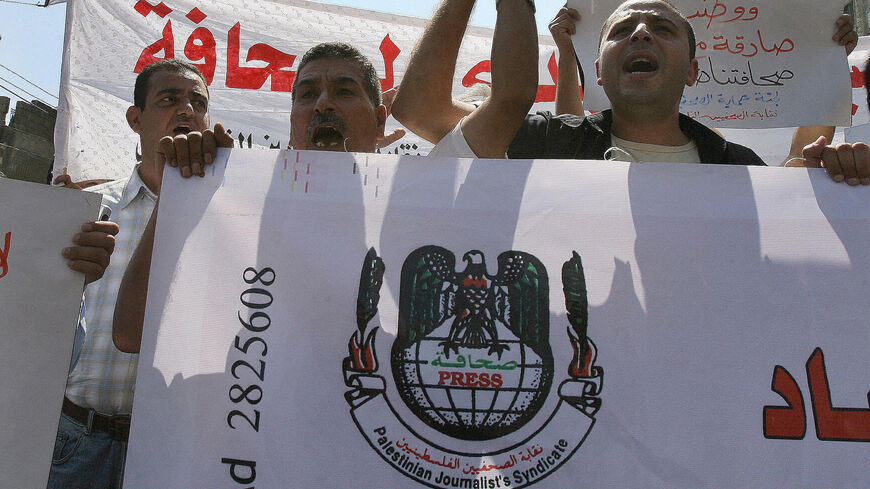 Palestinian journalists protest in Gaza City against attacks on journalists in the Palestinian territories, Aug. 28, 2007. 