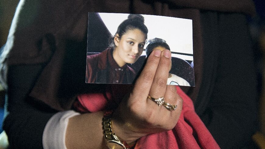 Begum's eldest sister Renu holds a photo of her as a teenager 