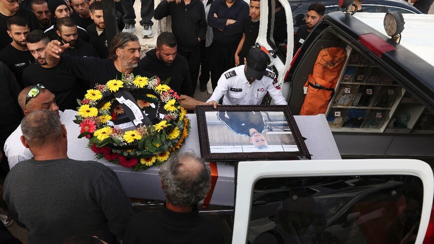 Israeli Druze men carry the coffin of 17-year-old Tiran Fero, during his funeral procession on Thursday in Daliyat al Karmel
