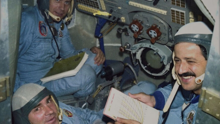 Muhammed Faris (R) is seen during the spaceflight aboard the Soyuz TM-3, July 1987.