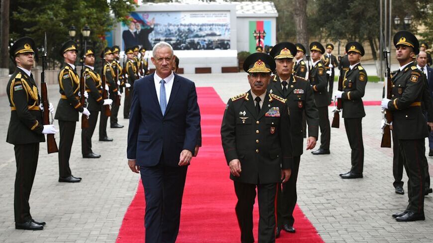 Israeli Defense Minister Benny Gantz walks with the chief of Azerbaijan's State Border Service, Col. Gen. Elchin Guliyev.