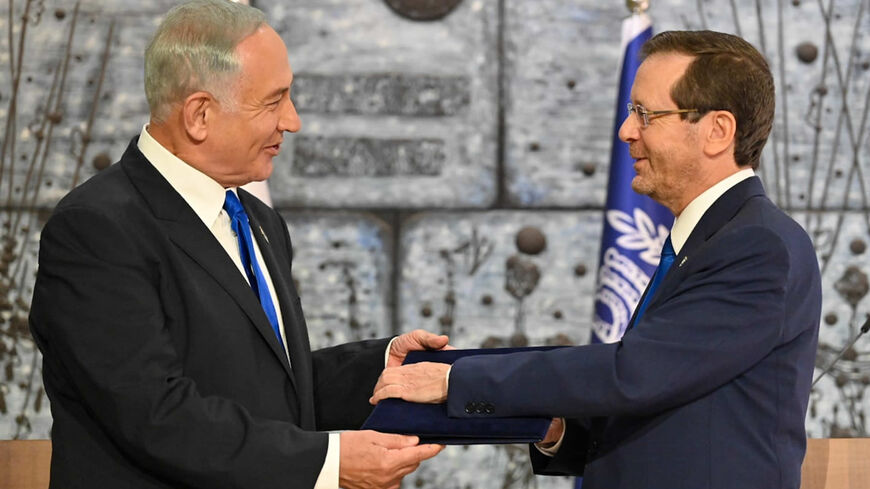 President Isaac Herzog welcomes Benjamin Netanyahu to the presidential residence before assigning the task of forming a government to him, Jerusalem, Nov. 13 2022.