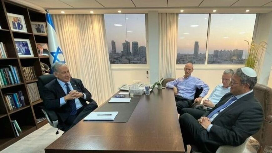Prime Minister-designate Benjamin Netanyahu (L) meets with Jewish Power leader Itamar Ben-Gvir at his office, Jerusalem, Nov. 7, 2022.