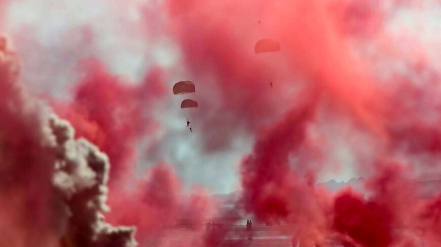 A handout picture provided by the Iranian Army on September 10, 2020, shows Iranian army paragliders during a military exercise near the strategic Strait of Hormuz in southern Iran