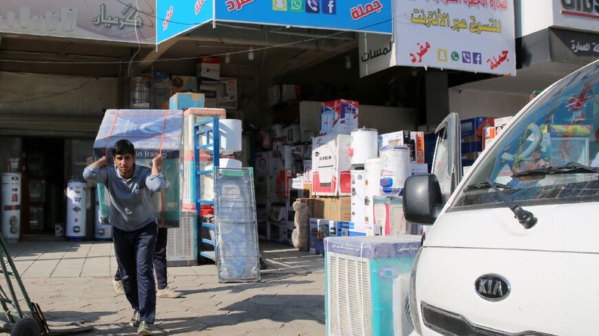 Air conditioners and electrical appliances imported from Iran are unloaded in Baghdad in February  2019
