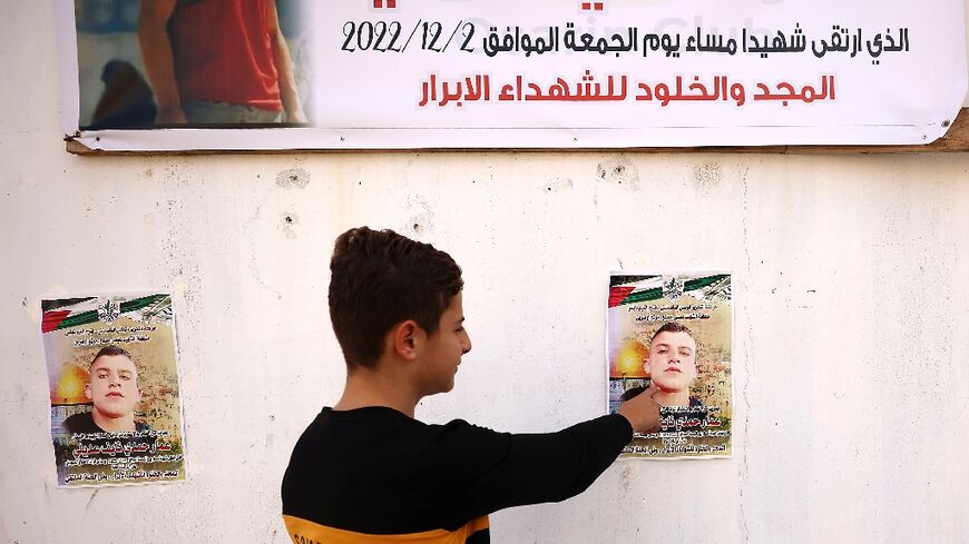 In his West Bank home village, posters mark Ammar Hadi Mufleh's death and his family seeks to claim his body