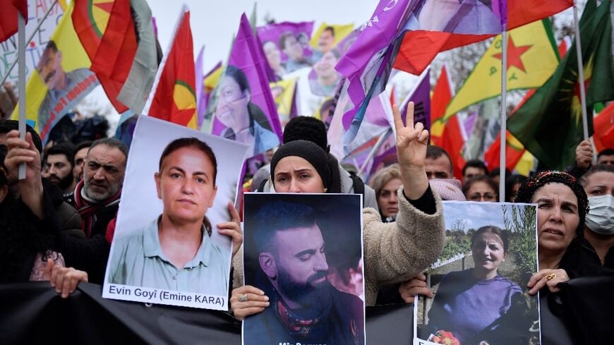 Supporters and members of the Kurdish community rallied in Paris after three people were killed in an attack on Friday