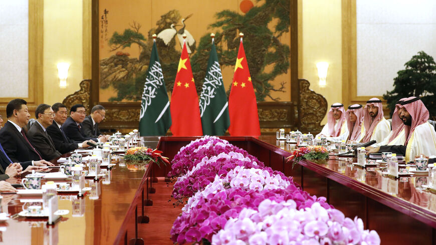 Saudi Crown Prince Mohammed bin Salman (R) attends a meeting with Chinese President Xi Jinping (L) at the Great Hall of the People in Beijing on Feb. 22, 2019.