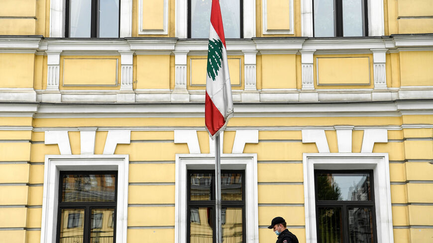 A Lebanese national flag flies at half-mast in tribute to victims of a massive explosion in Beirut at the Lebanese embassy in Moscow, Russia, Aug. 5, 2020.