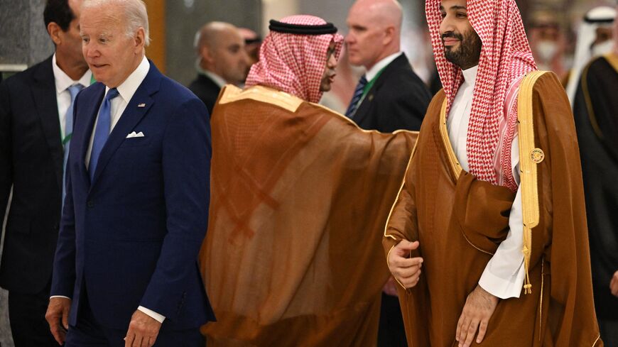 US President Joe Biden (L) and Saudi Crown Prince Mohammed bin Salman (R) arrive for the family photo during the Jeddah Security and Development Summit (GCC+3) at a hotel in Saudi Arabia's Red Sea coastal city of Jeddah on July 16, 2022. (Photo by MANDEL NGAN/POOL/AFP via Getty Images)